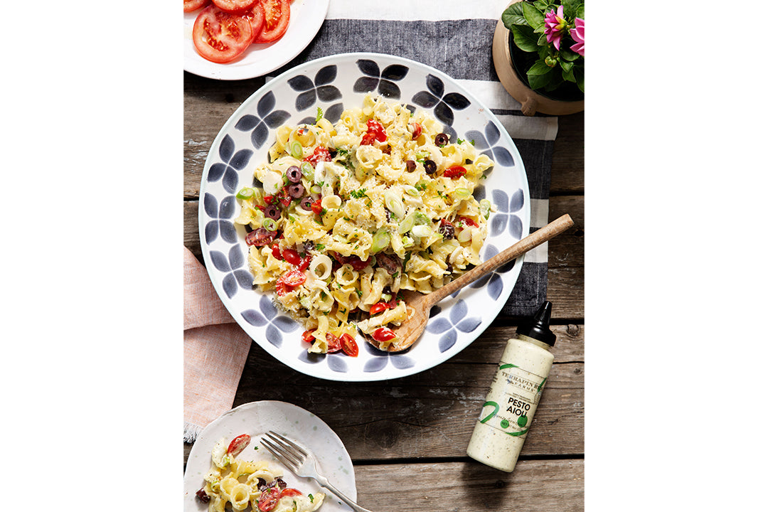 Pesto Pasta Salad with Terrapin Ridge Farms Pesto Aioli Garnishing Squeeze Pesto Pasta Salad with Terrapin Ridge Farms Pesto Aioli Garnishing Squeeze